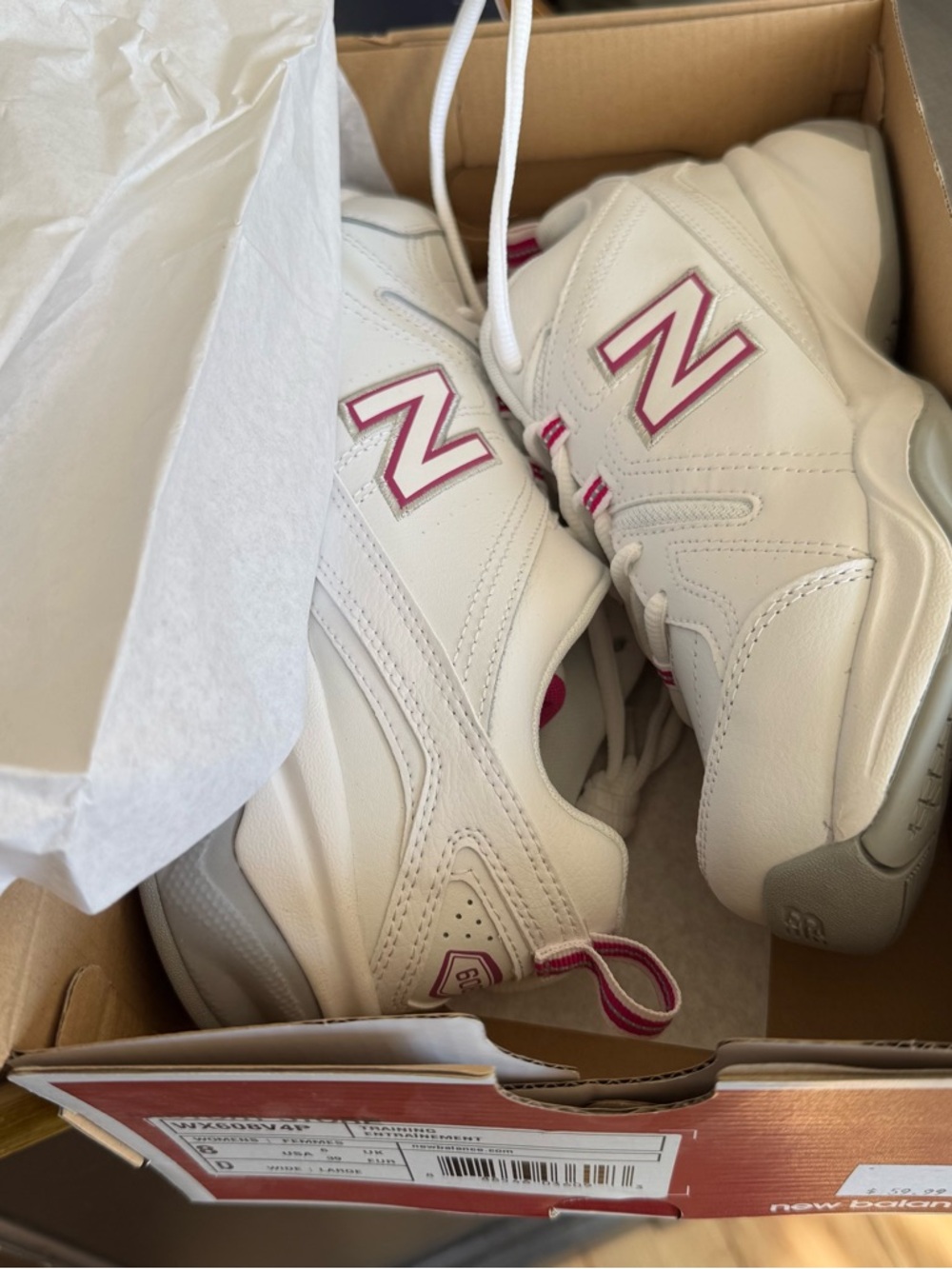 New Balance 608v4 White Training Sneakers with Pink Detailing